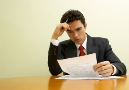 Man Reading Letter, Actually, it looks like a long memo, but for our needs, totally a letter.